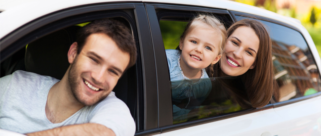 Happy family in car
