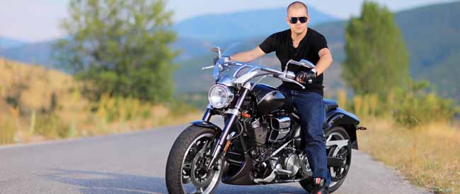 Man on a costume made motorcycle on the road